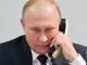Путин и телефон. Фото: m24.ru